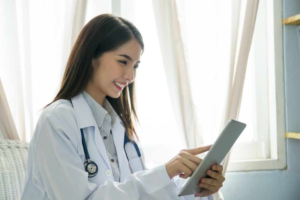 Female doctor work with digital tablet. Medicine technology concept.